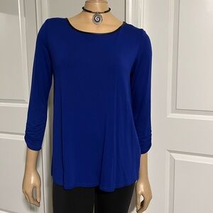 Pretty blue shirt with faux leather trim, never worn, size M.